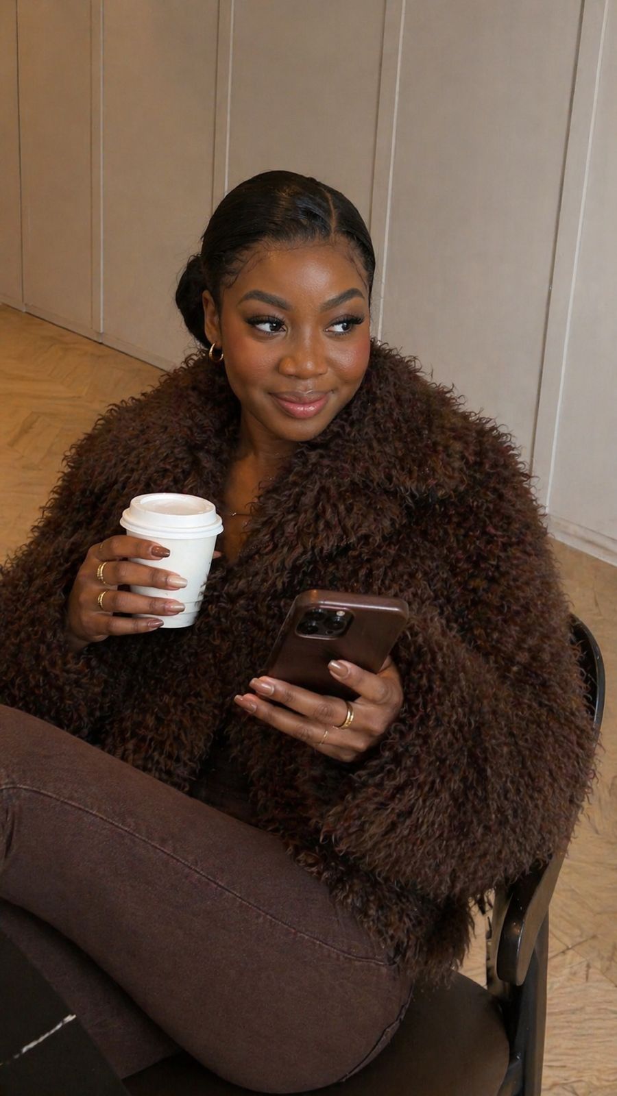 Mary Kumba working from her phone